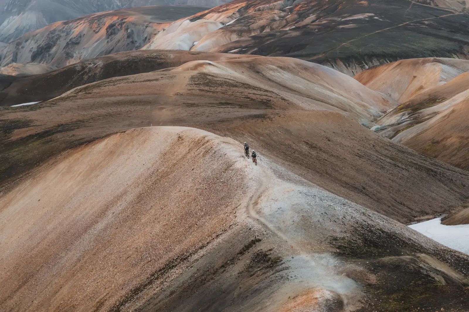 Two cyclists crossing the remote Icelandic highlands during an outdoor media production